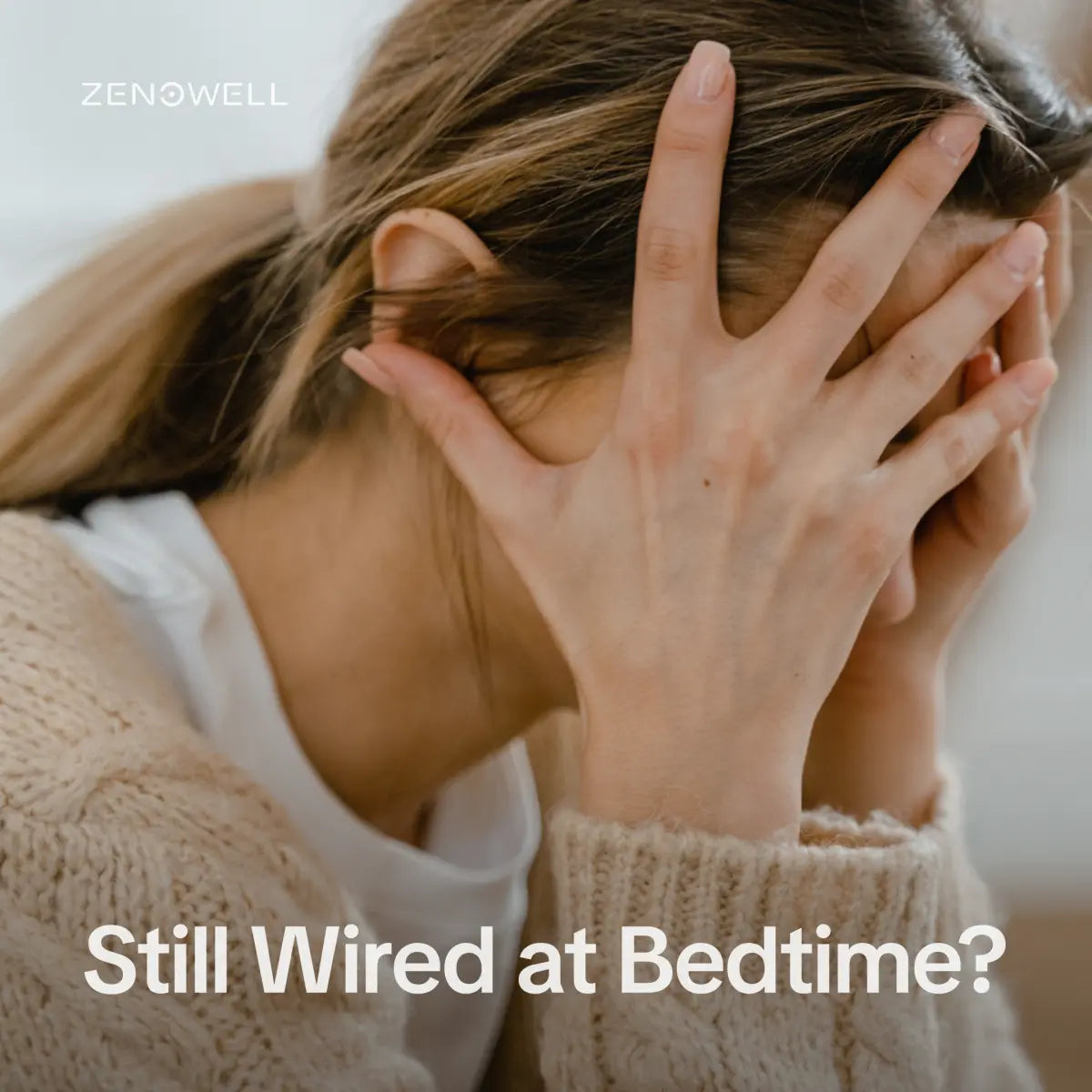 Woman covering her face while feeling wired and overwhelmed at bedtime